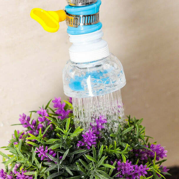 Colorful garden hose nozzle watering purple flowers against a beige background