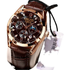 Luxury watch with brown leather strap and rose gold case on a white background