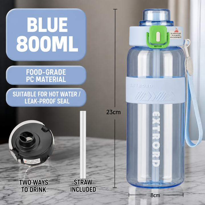 A clear blue EXTRORD 800ml water bottle with a light blue band, white lid, and green flip-straw cap, shown on a marble countertop with measurement labels and feature callouts.