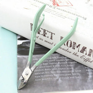Nail care kit with cuticle nipper tweezers scissors and nail file