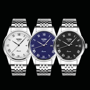 Three SKMEI 1853 quartz wristwatches with stainless steel link bracelets, shown side by side against a black background. The watches have white, blue, and black dials with Roman numeral hour markers.