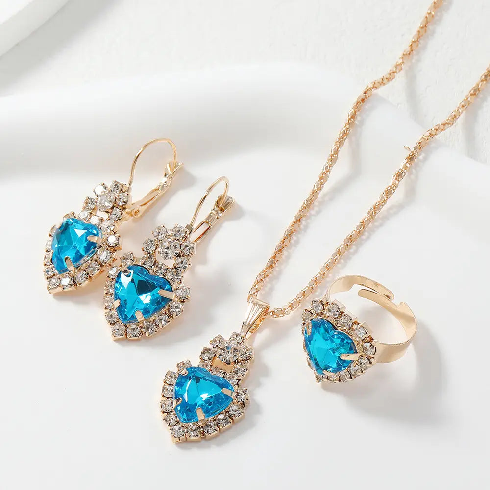 Jewelry set with blue gemstones on a white background